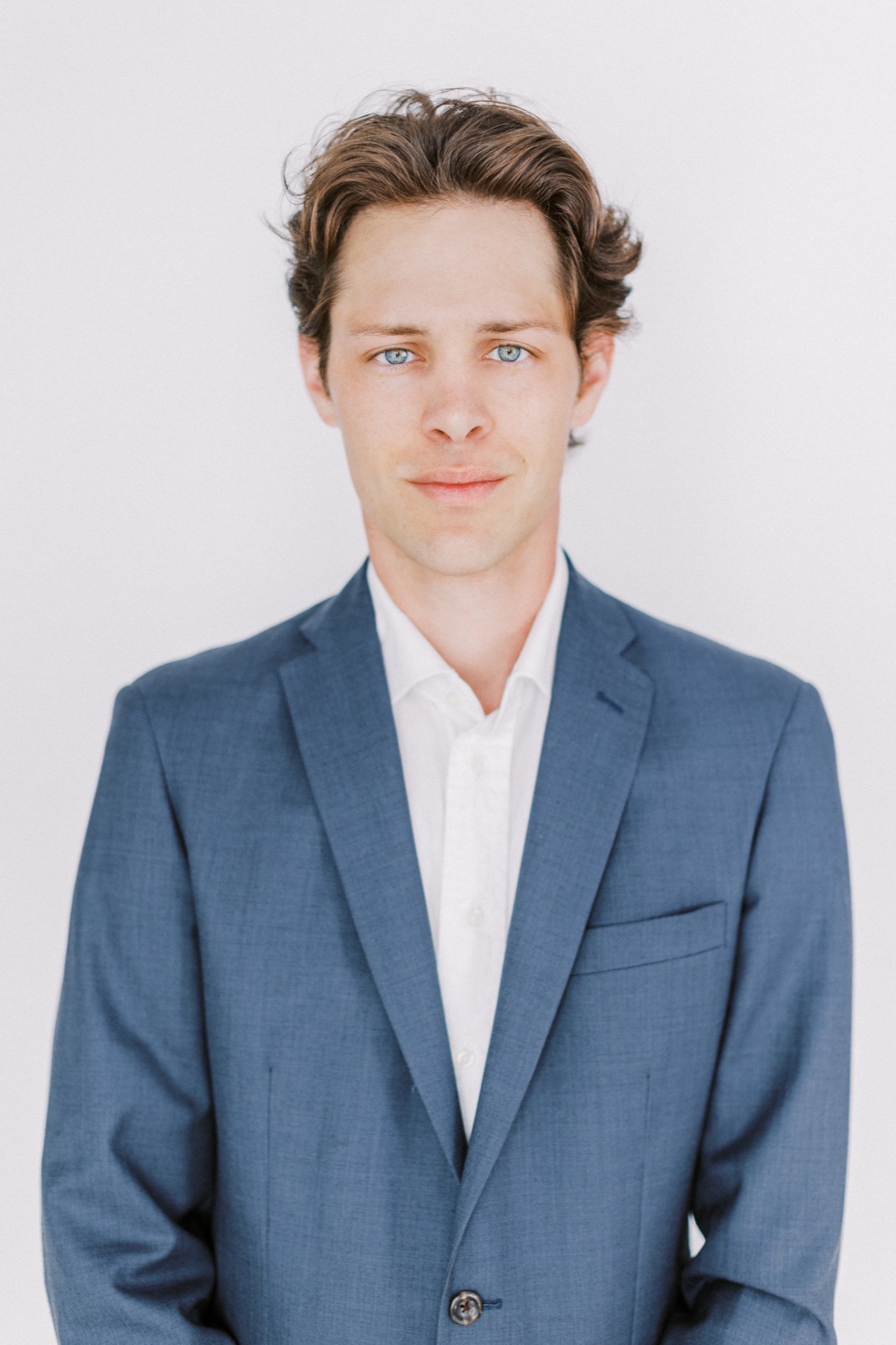Blake Boyd in a blue suit, photographed against a light background.